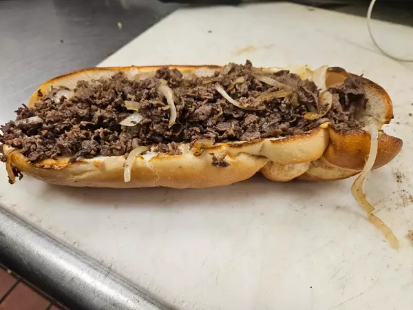 Original Eagle Pizza preparing a Cheesesteak in Havertown, PA